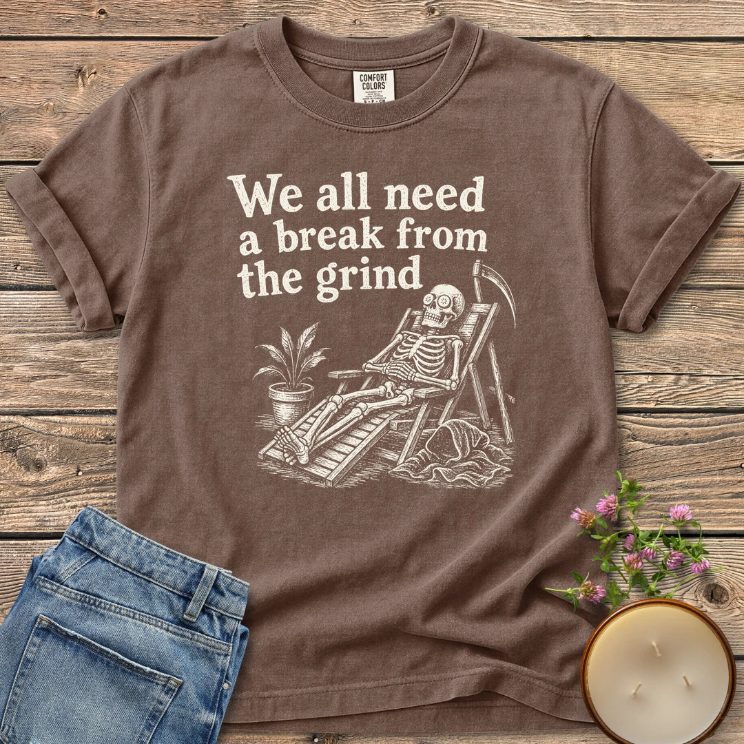 A Break From the Grind t-shirt, a skeleton relaxing in a beach chair with a houseplant under We all need a break from the grind, on an Espresso Comfort Colors tee