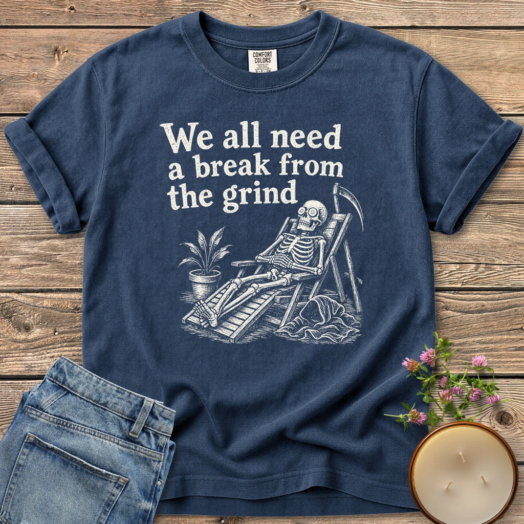 A Break From the Grind t-shirt, a skeleton relaxing in a beach chair with a houseplant under We all need a break from the grind, on a Navy Comfort Colors tee