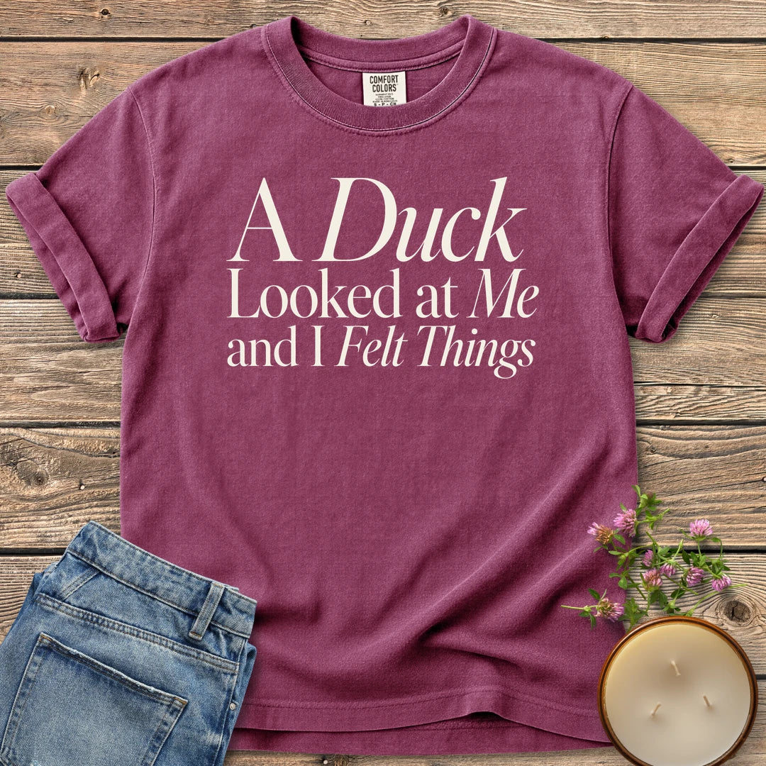 A Duck Looked at Me t-shirt, A Duck Looked at Me and I Felt Things in elegant serif and italic type, on a Berry Comfort Colors tee