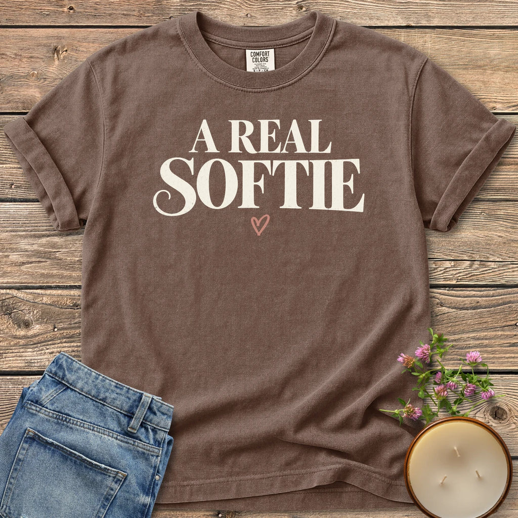 A Real Softie Vintage t-shirt, A Real Softie in vintage serif type with a small heart, on an Espresso Comfort Colors tee