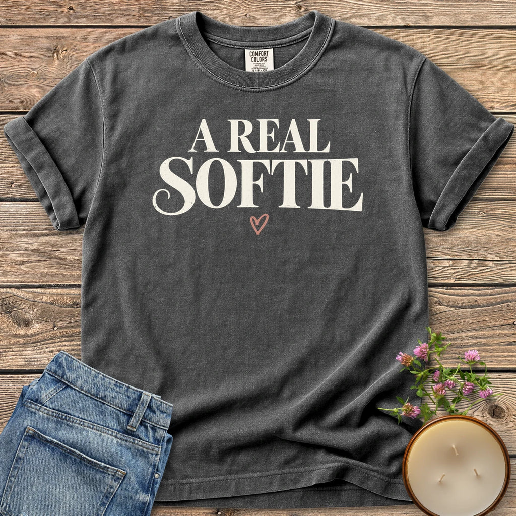 A Real Softie Vintage t-shirt, A Real Softie in vintage serif type with a small heart, on a Pepper Comfort Colors tee