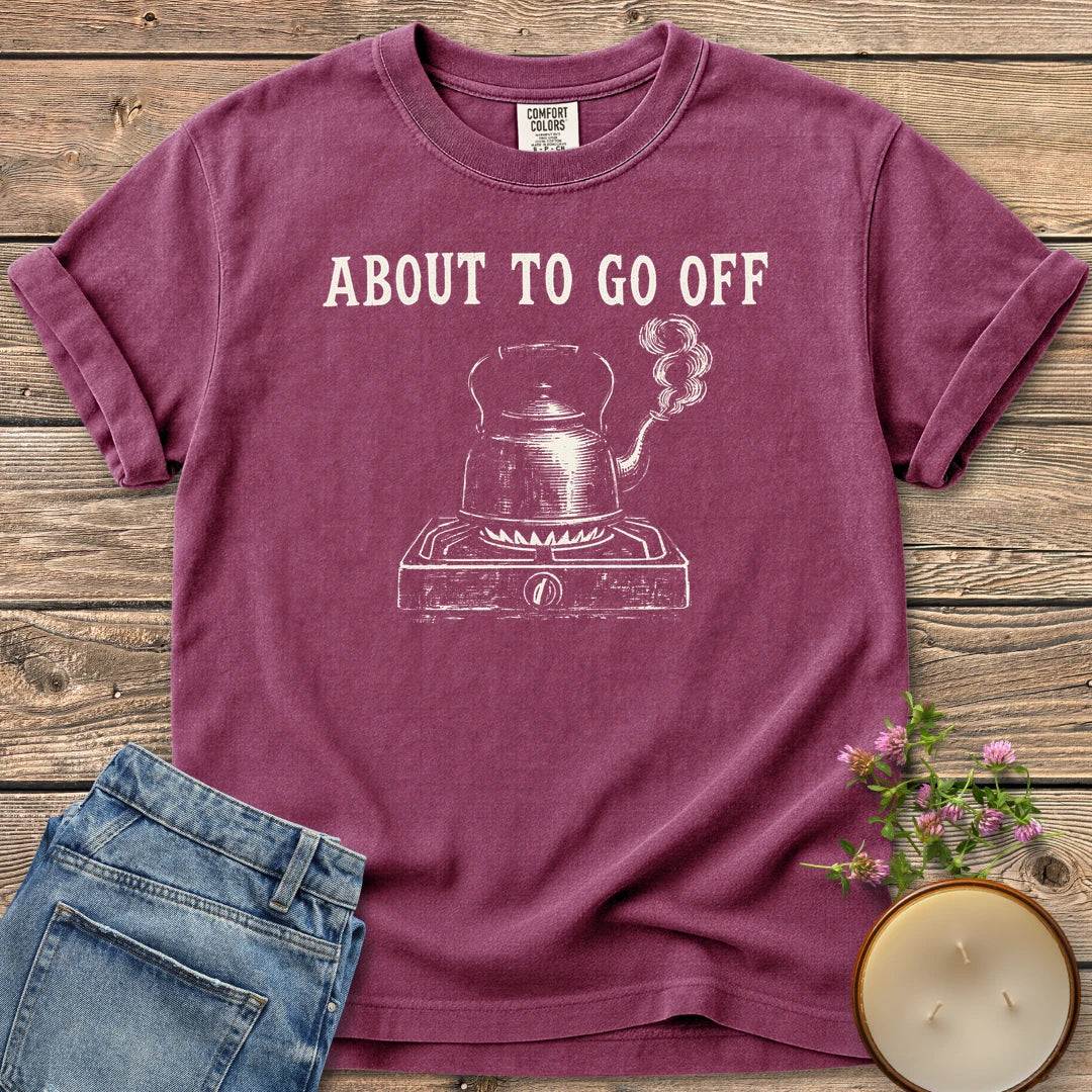 About to Go Off t-shirt, a whistling tea kettle on a burner under About To Go Off, on a Berry Comfort Colors tee
