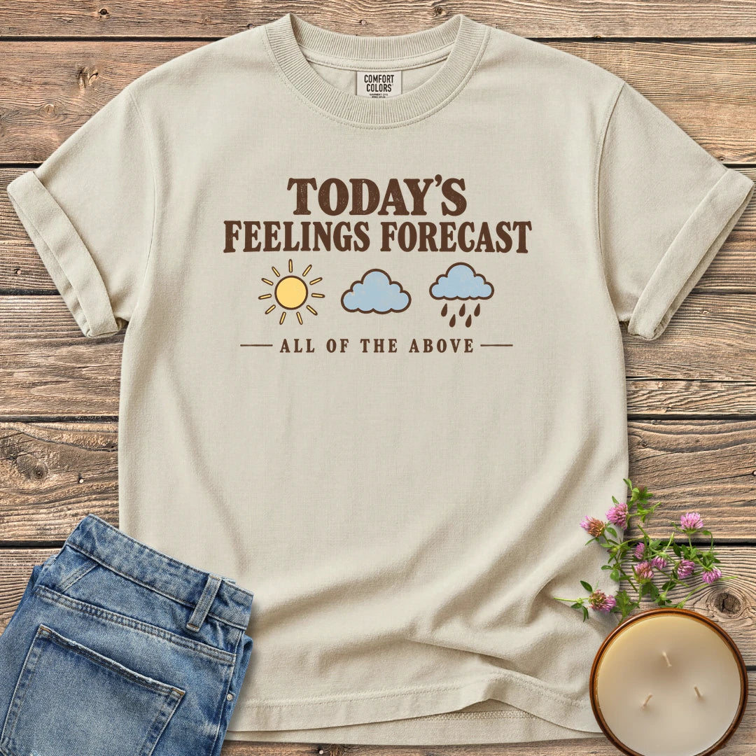 All Of The Above t-shirt, Today's Feelings Forecast with sun, cloud and rain icons over All of the Above, on an Ivory Comfort Colors tee