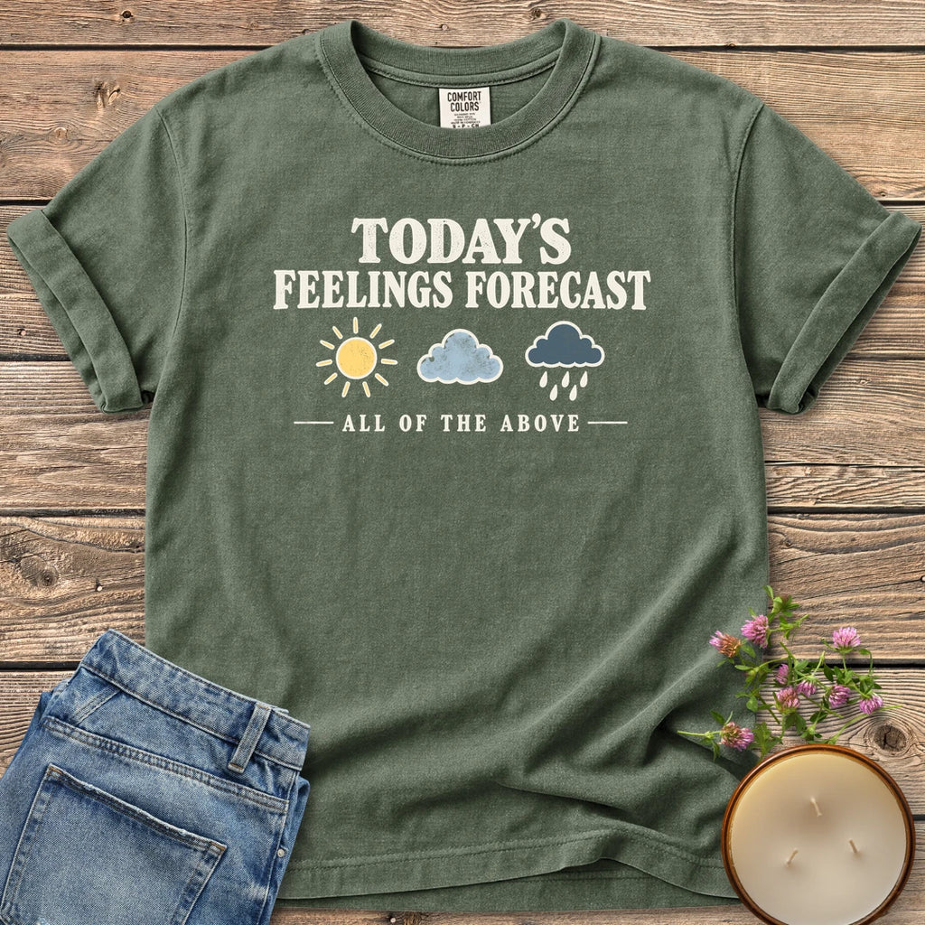 All Of The Above t-shirt, Today's Feelings Forecast with sun, cloud and rain icons over All of the Above, on a Moss Comfort Colors tee