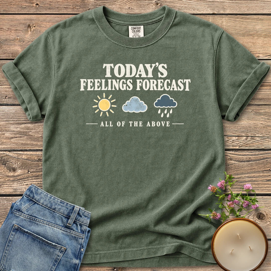 All Of The Above t-shirt, Today's Feelings Forecast with sun, cloud and rain icons over All of the Above, on a Moss Comfort Colors tee