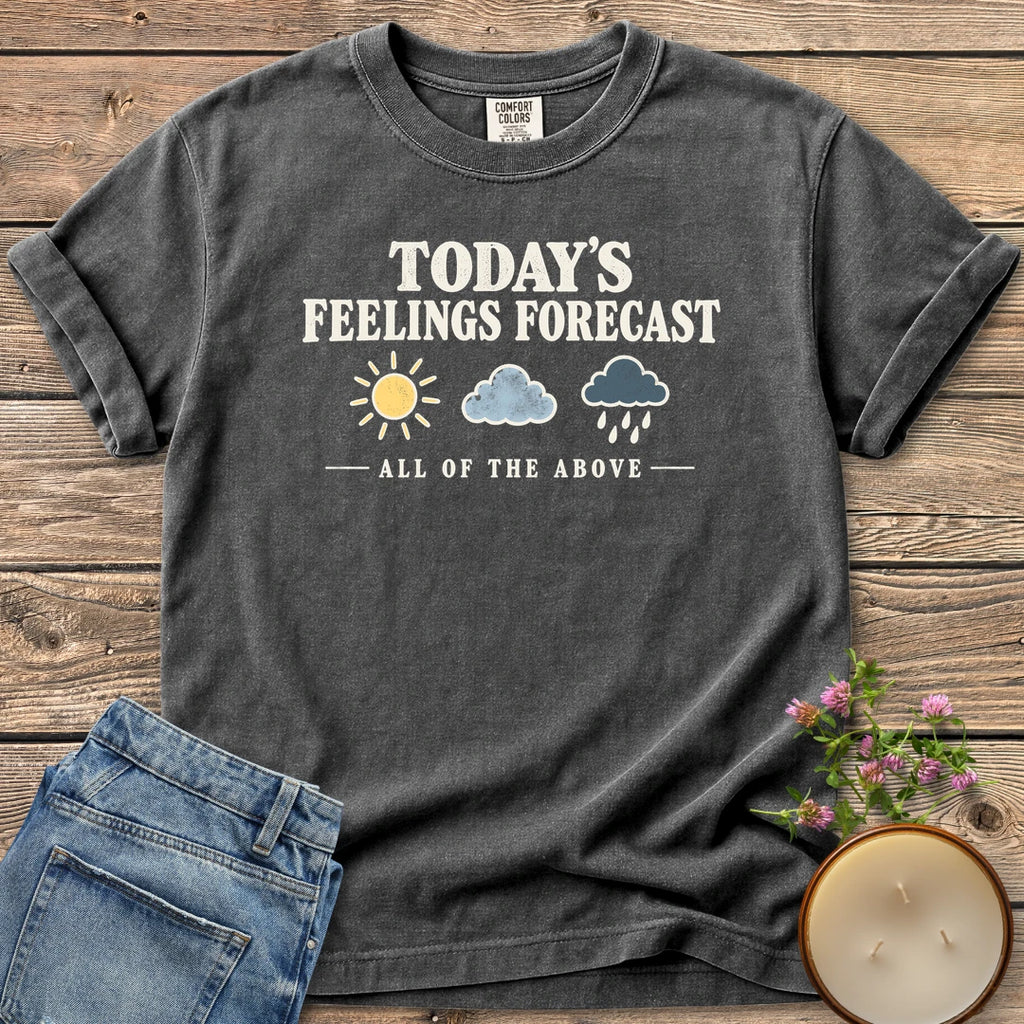 All Of The Above t-shirt, Today's Feelings Forecast with sun, cloud and rain icons over All of the Above, on a Pepper Comfort Colors tee