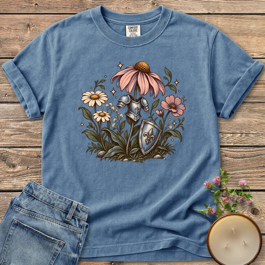 Armored Flower Knight t-shirt, pink coneflowers and daisies wearing a knight's armor and shield, on a Blue Jean Comfort Colors tee