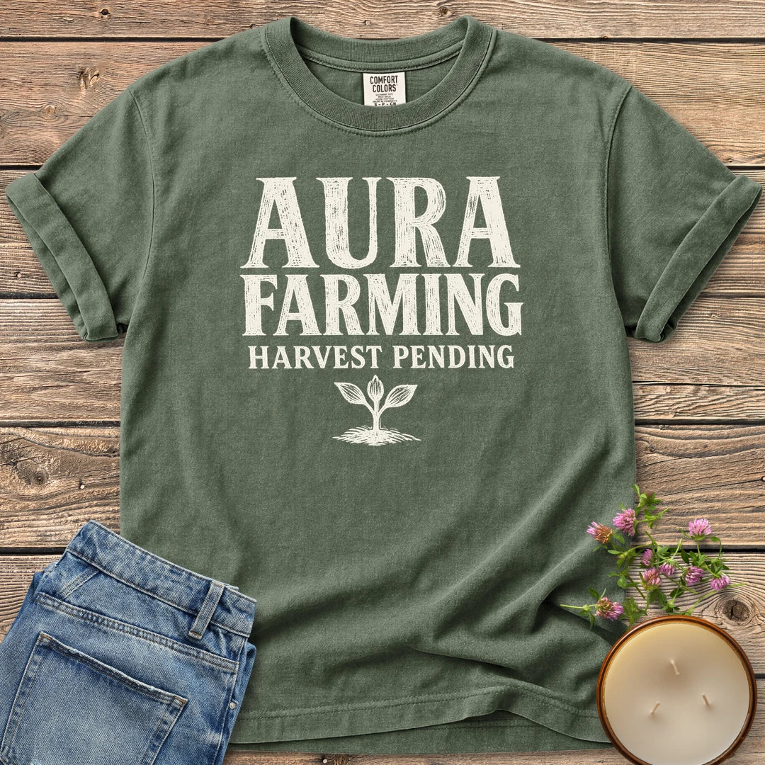 Aura Farming Harvest Pending t-shirt, Aura Farming in woodcut letters with Harvest Pending and a small sprout, on a Moss Comfort Colors tee