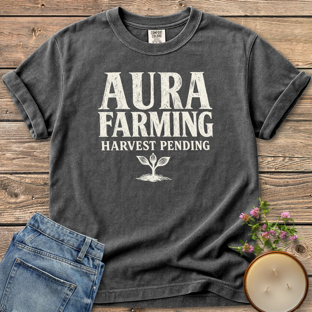 Aura Farming Harvest Pending t-shirt, Aura Farming in woodcut letters with Harvest Pending and a small sprout, on a Pepper Comfort Colors tee