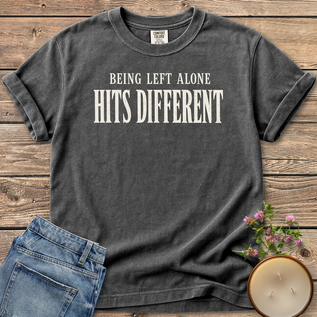 Being Left Alone Hits Different t-shirt, Being Left Alone Hits Different in distressed vintage type, on a Pepper Comfort Colors tee