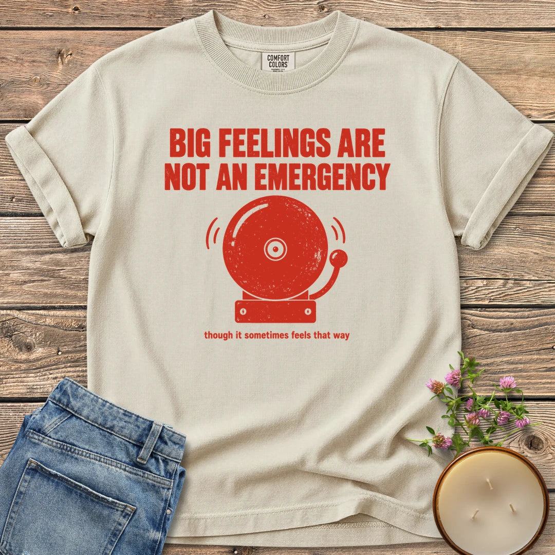 Big Feelings Not An Emergency t-shirt, Big Feelings Are Not An Emergency above a ringing alarm bell, on an Ivory Comfort Colors tee