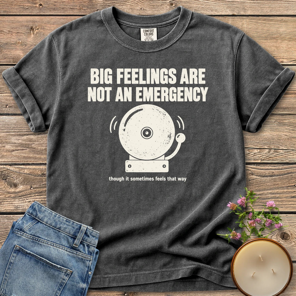 Big Feelings Not An Emergency t-shirt, Big Feelings Are Not An Emergency above a ringing alarm bell, on a Pepper Comfort Colors tee