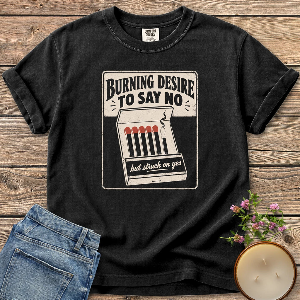 Burning Desire To Say No t-shirt, a vintage matchbook reading Burning Desire To Say No with but struck on yes, on a Black Comfort Colors tee