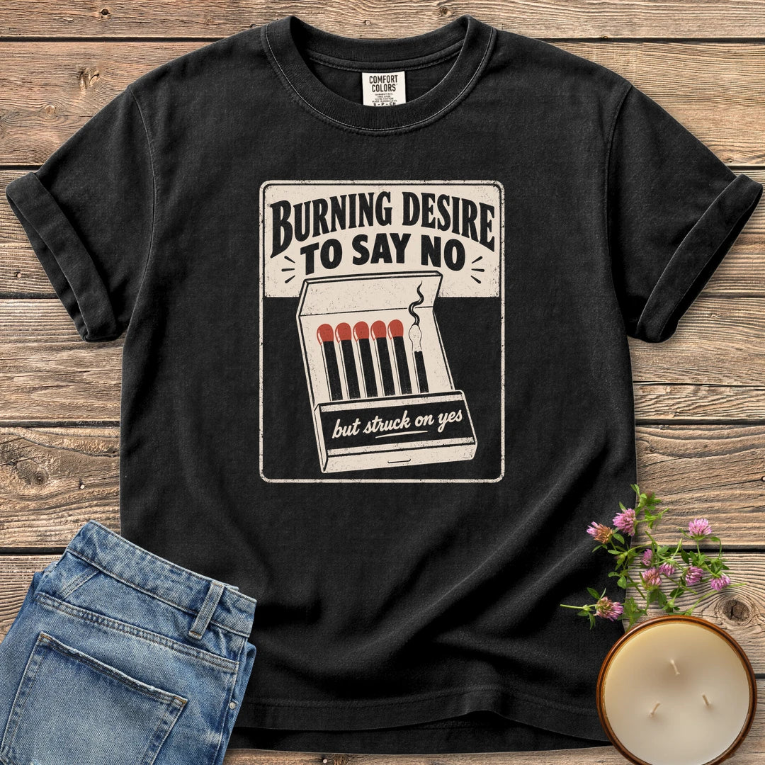 Burning Desire To Say No t-shirt, a vintage matchbook reading Burning Desire To Say No with but struck on yes, on a Black Comfort Colors tee