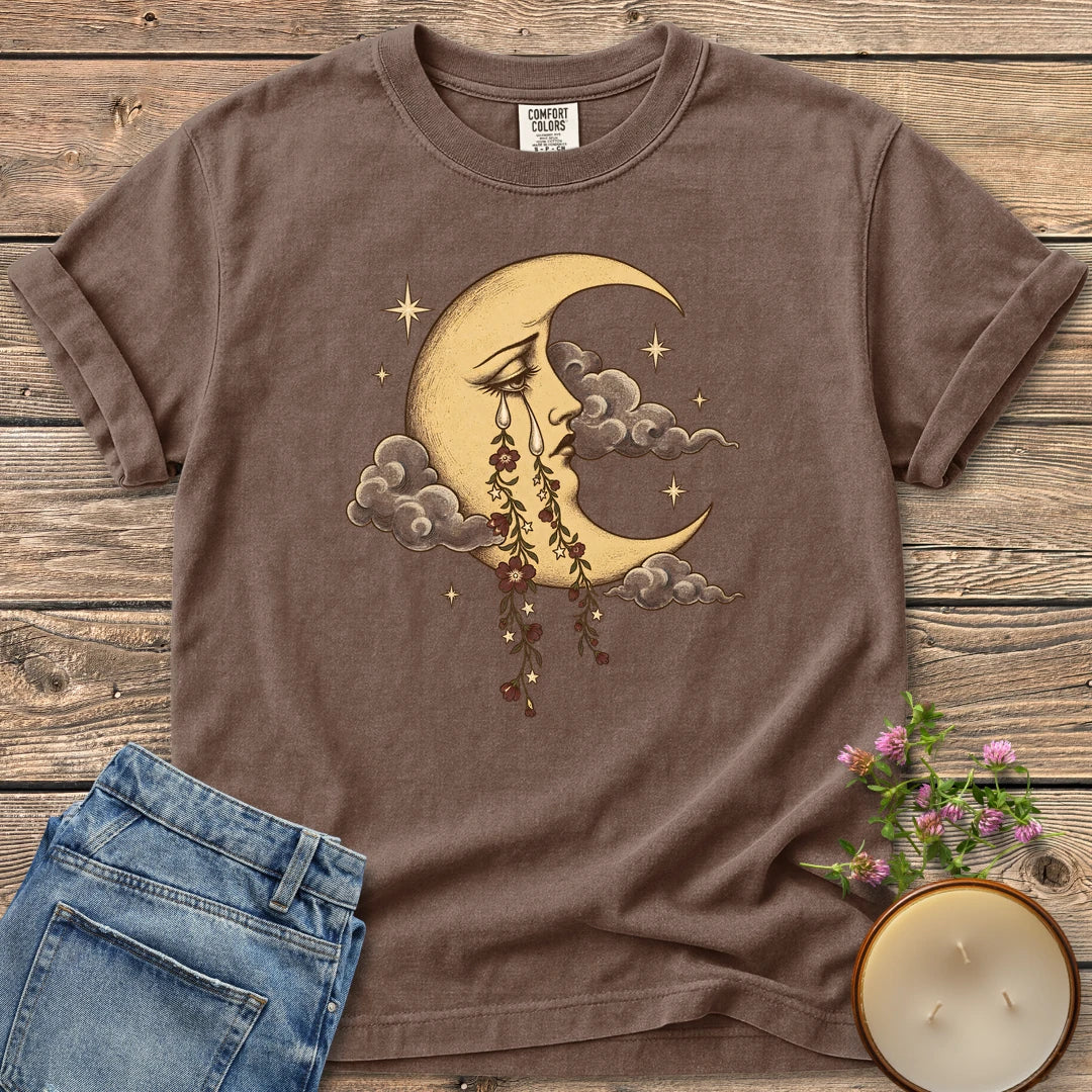 Crescent Moon Floral Tears t-shirt, a crescent moon crying tears of hanging flowers among clouds and stars, on an Espresso Comfort Colors tee