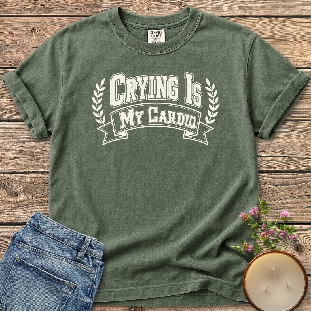 Crying Is My Cardio t-shirt, Crying Is My Cardio in varsity letters on a banner with laurel branches, on a Moss Comfort Colors tee