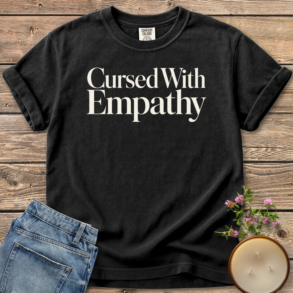 Cursed With Empathy t-shirt, Cursed With Empathy in elegant serif type, on a Black Comfort Colors tee