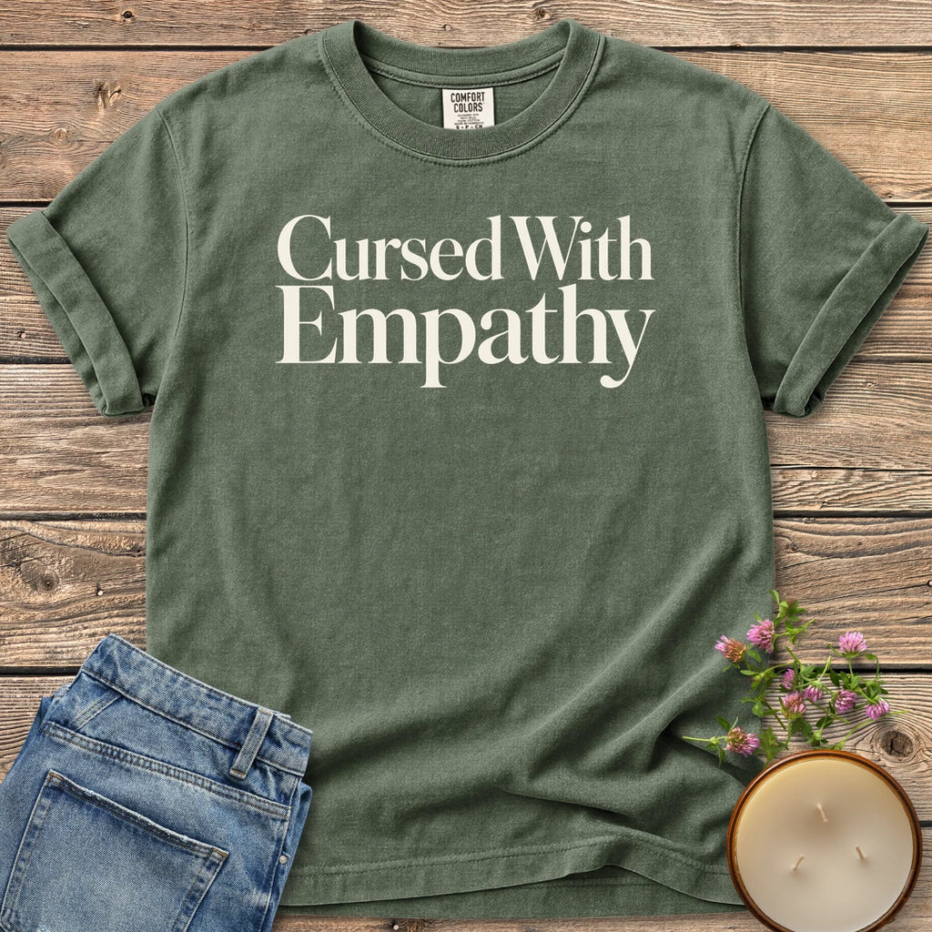 Cursed With Empathy t-shirt, Cursed With Empathy in elegant serif type, on a Moss Comfort Colors tee
