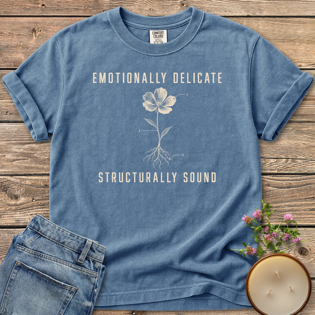 Emotionally Delicate Structurally Sound t-shirt, a labeled flower diagram between Emotionally Delicate and Structurally Sound, on a Blue Jean Comfort Colors tee