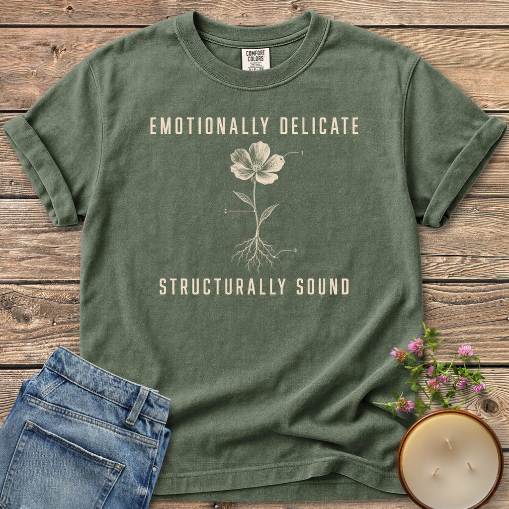 Emotionally Delicate Structurally Sound t-shirt, a labeled flower diagram between Emotionally Delicate and Structurally Sound, on a Moss Comfort Colors tee