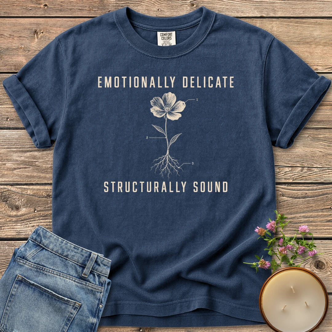 Emotionally Delicate Structurally Sound t-shirt, a labeled flower diagram between Emotionally Delicate and Structurally Sound, on a Navy Comfort Colors tee
