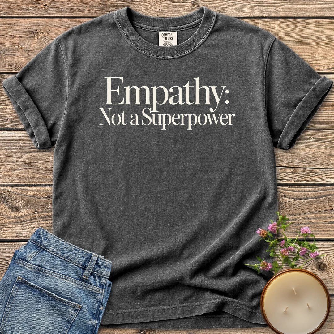Empathy Not a Superpower t-shirt, Empathy: Not a Superpower in elegant serif type, on a Pepper Comfort Colors tee