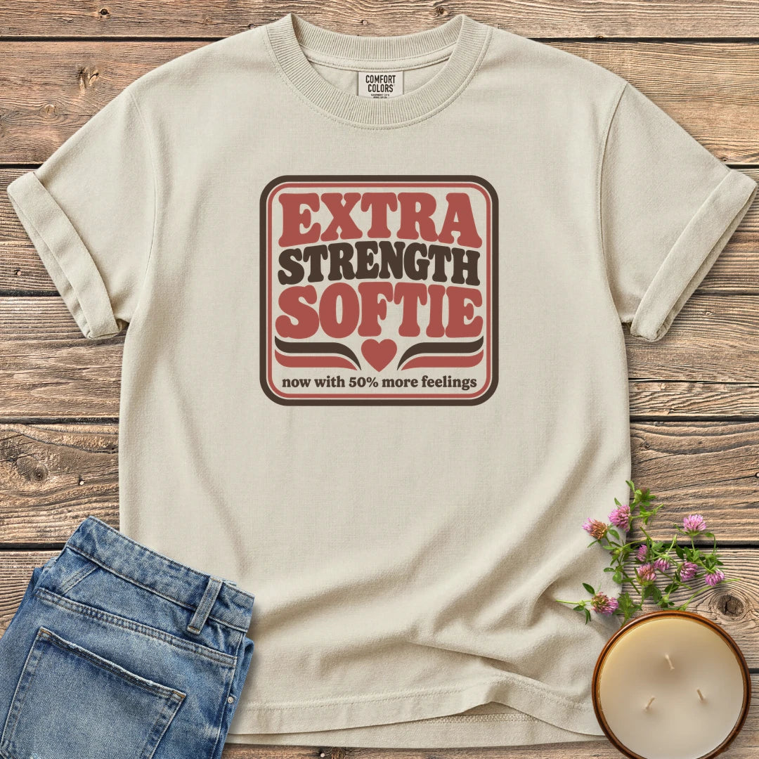 Extra Strength Softie t-shirt, a retro badge reading Extra Strength Softie with a heart and now with 50% more feelings, on an Ivory Comfort Colors tee