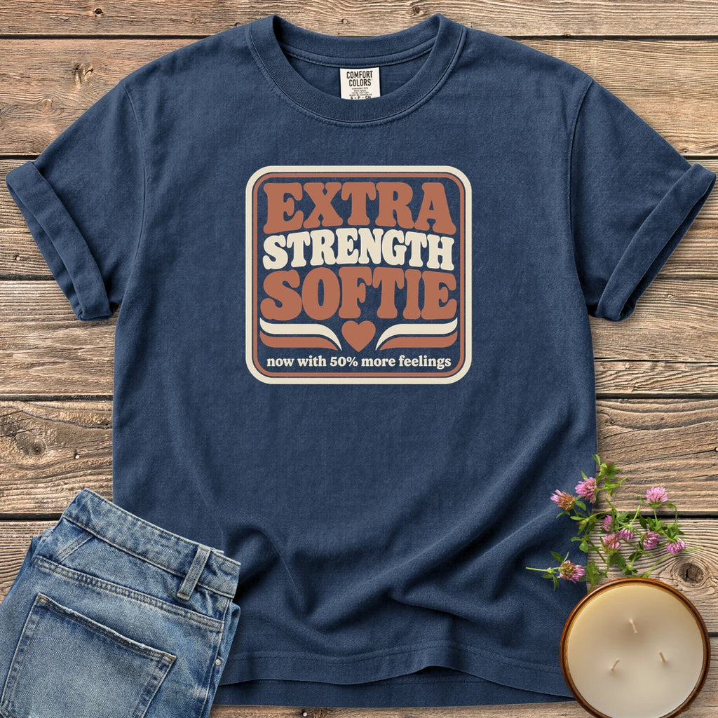 Extra Strength Softie t-shirt, a retro badge reading Extra Strength Softie with a heart and now with 50% more feelings, on a Navy Comfort Colors tee