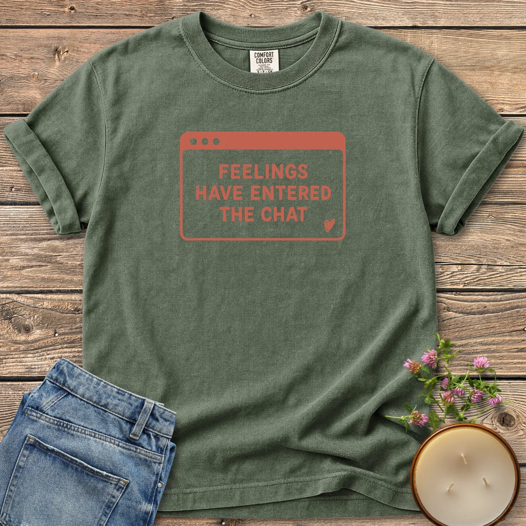 Feelings Have Entered The Chat t-shirt, a retro browser window reading Feelings Have Entered The Chat with a small heart, on a Moss Comfort Colors tee