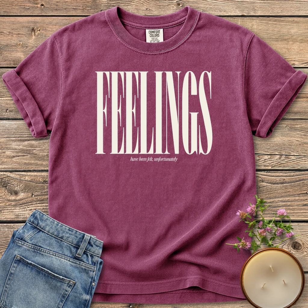 Feelings Unfortunately t-shirt, FEELINGS in tall condensed type with have been felt, unfortunately, on a Berry Comfort Colors tee