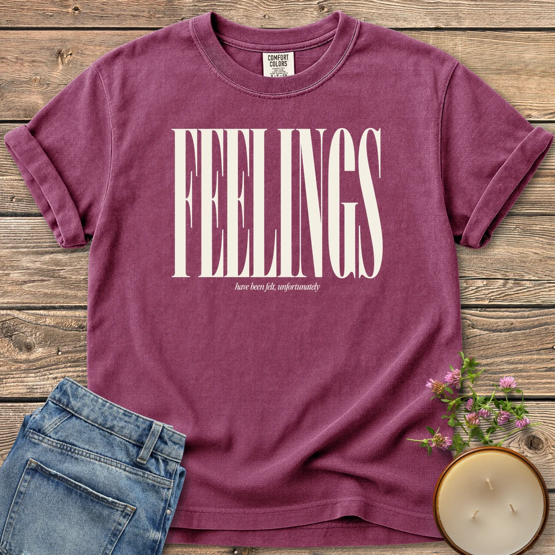 Feelings Unfortunately t-shirt, FEELINGS in tall condensed type with have been felt, unfortunately, on a Berry Comfort Colors tee