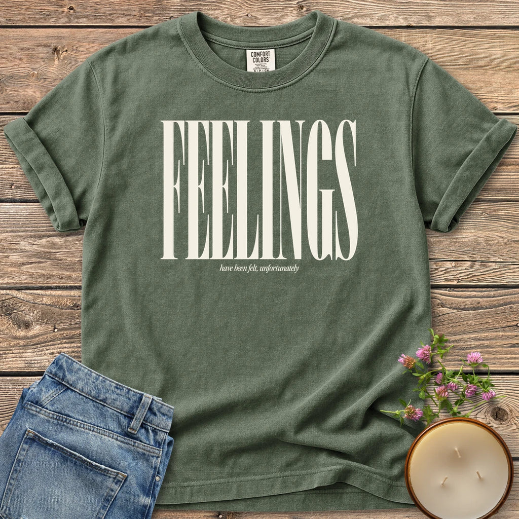 Feelings Unfortunately t-shirt, FEELINGS in tall condensed type with have been felt, unfortunately, on a Moss Comfort Colors tee