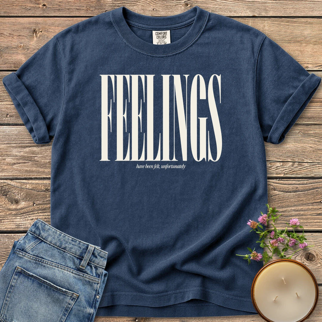 Feelings Unfortunately t-shirt, FEELINGS in tall condensed type with have been felt, unfortunately, on a Navy Comfort Colors tee