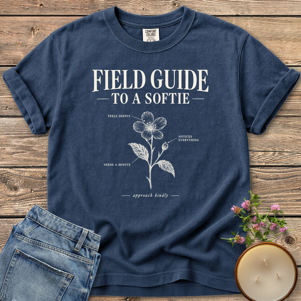 Field Guide To A Softie t-shirt, Field Guide To A Softie with a labeled flower reading feels deeply, notices everything, needs a minute, on a Navy Comfort Colors tee