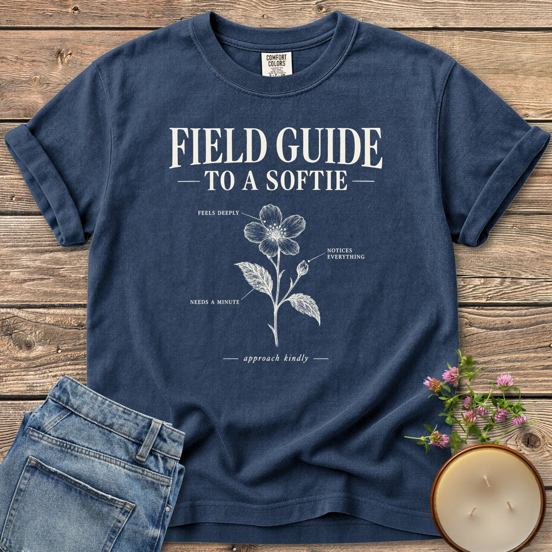 Field Guide To A Softie t-shirt, Field Guide To A Softie with a labeled flower reading feels deeply, notices everything, needs a minute, on a Navy Comfort Colors tee