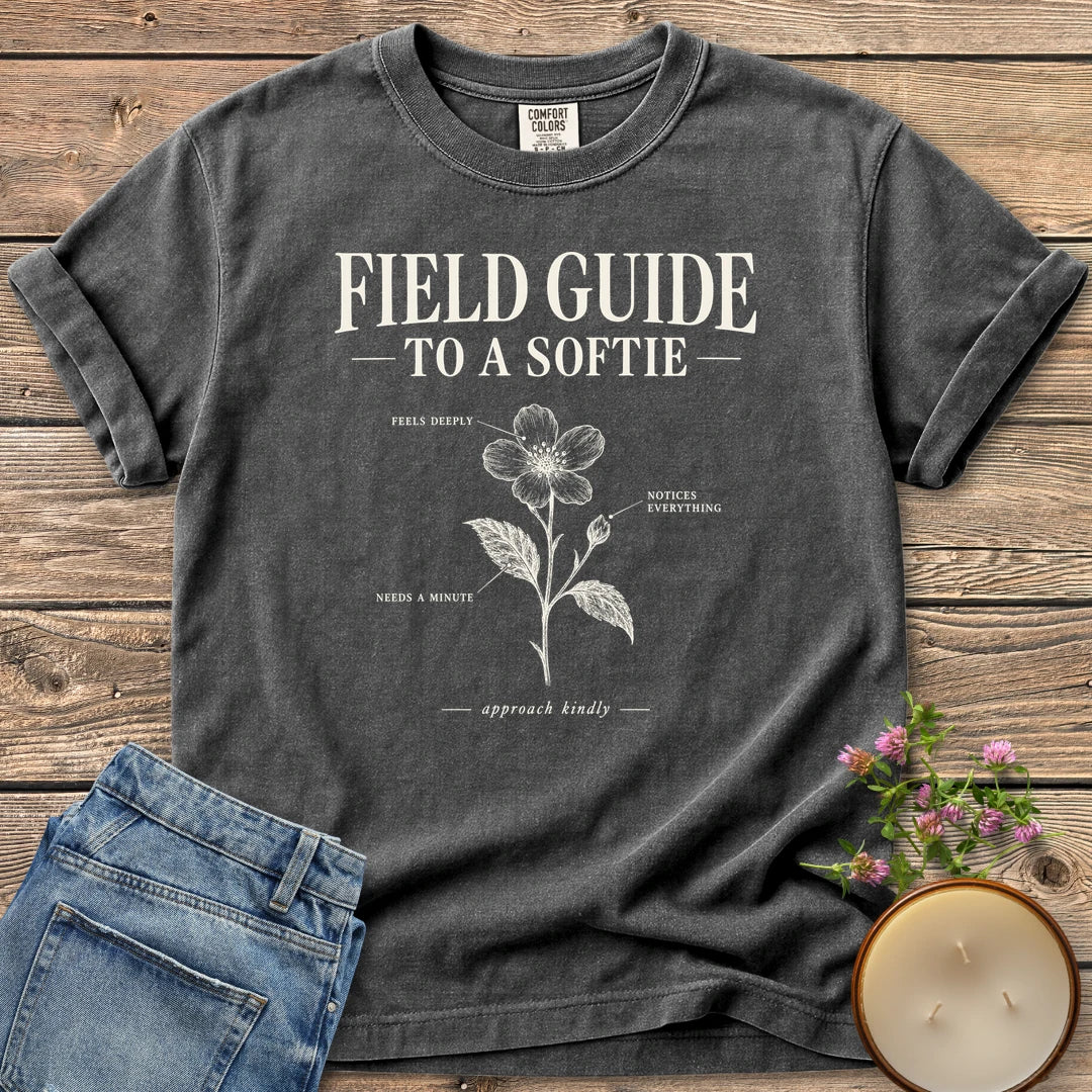 Field Guide To A Softie t-shirt, Field Guide To A Softie with a labeled flower reading feels deeply, notices everything, needs a minute, on a Pepper Comfort Colors tee