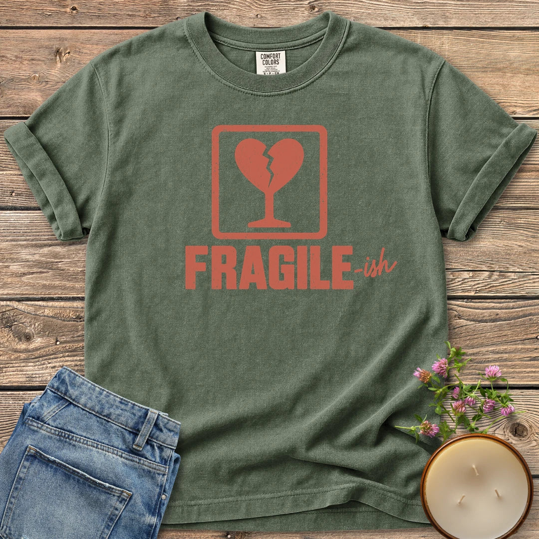 Fragile-ish t-shirt, a shipping label with a broken heart and cracked glass above Fragile-ish, on a Moss Comfort Colors tee