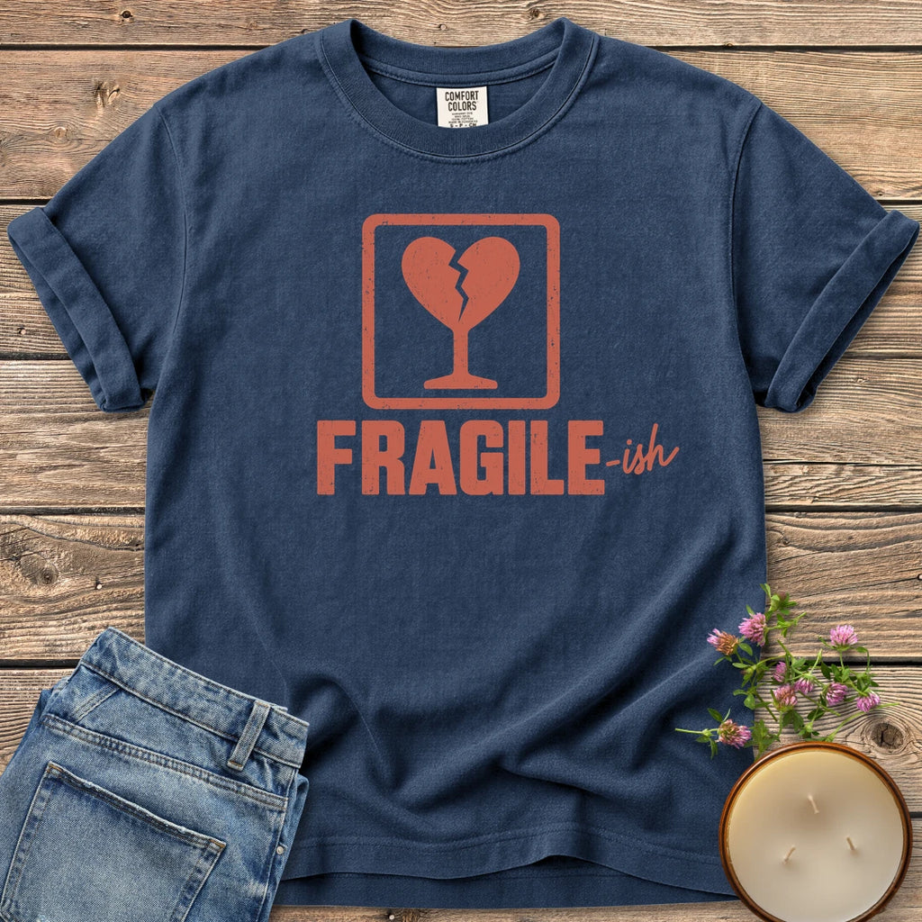Fragile-ish t-shirt, a shipping label with a broken heart and cracked glass above Fragile-ish, on a Navy Comfort Colors tee