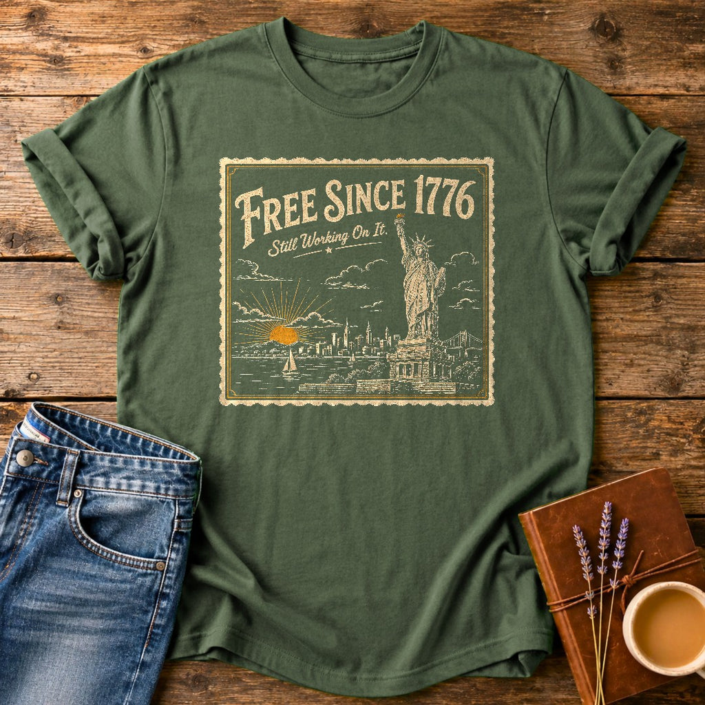 Free Since 1776 — Moss garment-dyed tee