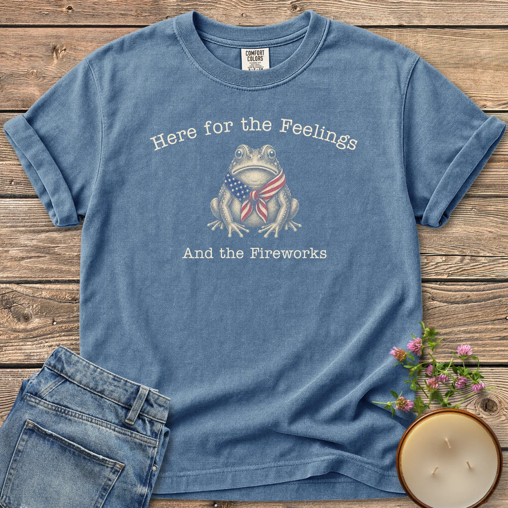 Here for the Feelings t-shirt, a toad in a stars and stripes bandana between Here for the Feelings and And the Fireworks, on a Blue Jean Comfort Colors tee