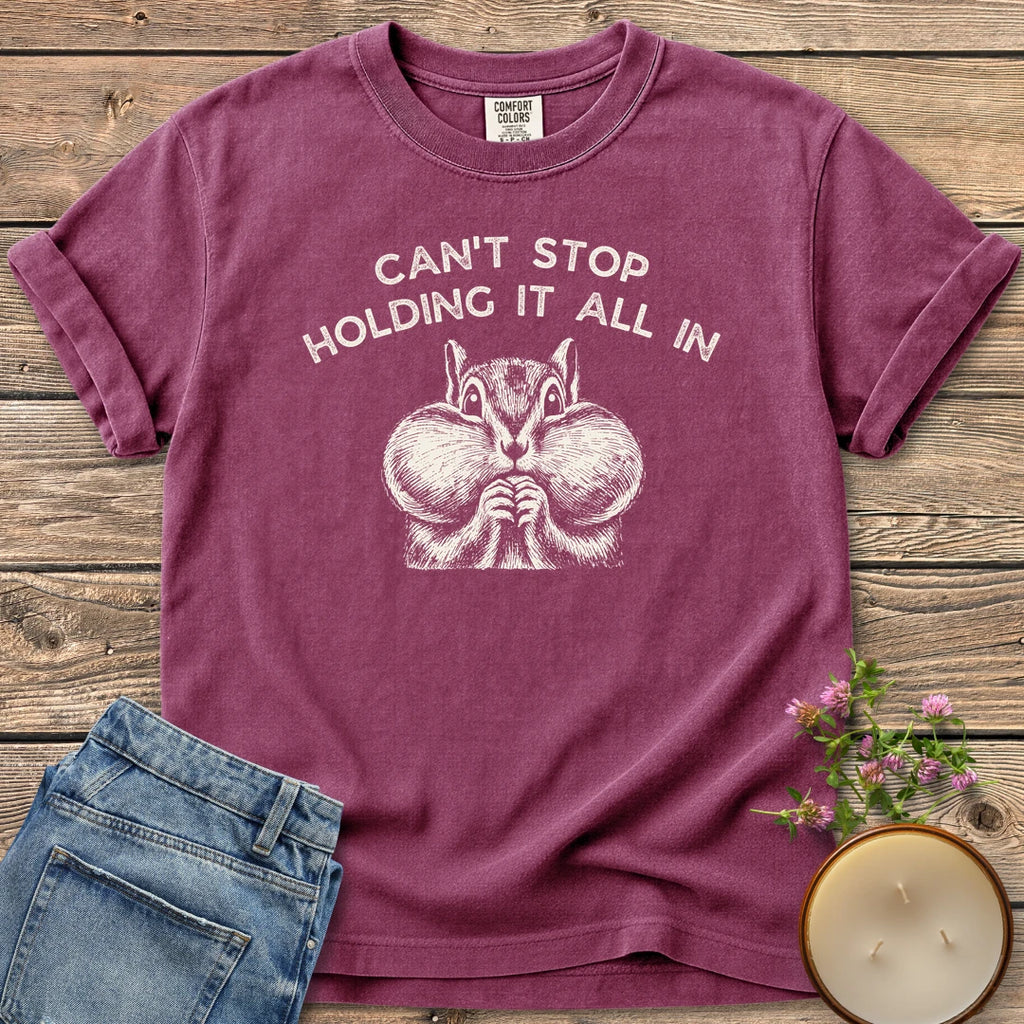 Holding It All In t-shirt, a chipmunk with puffed cheeks under Can't Stop Holding It All In, on a Berry Comfort Colors tee