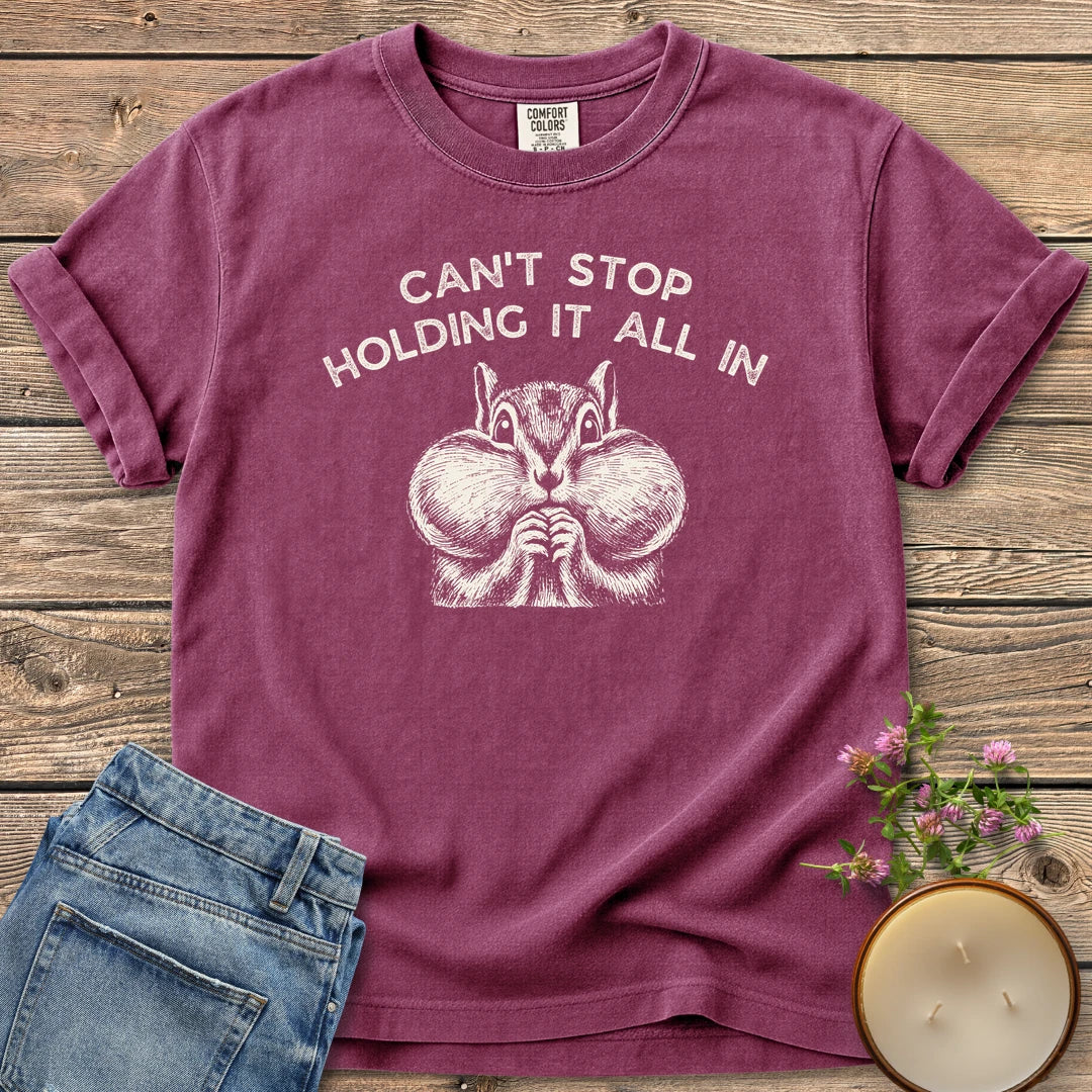Holding It All In t-shirt, a chipmunk with puffed cheeks under Can't Stop Holding It All In, on a Berry Comfort Colors tee