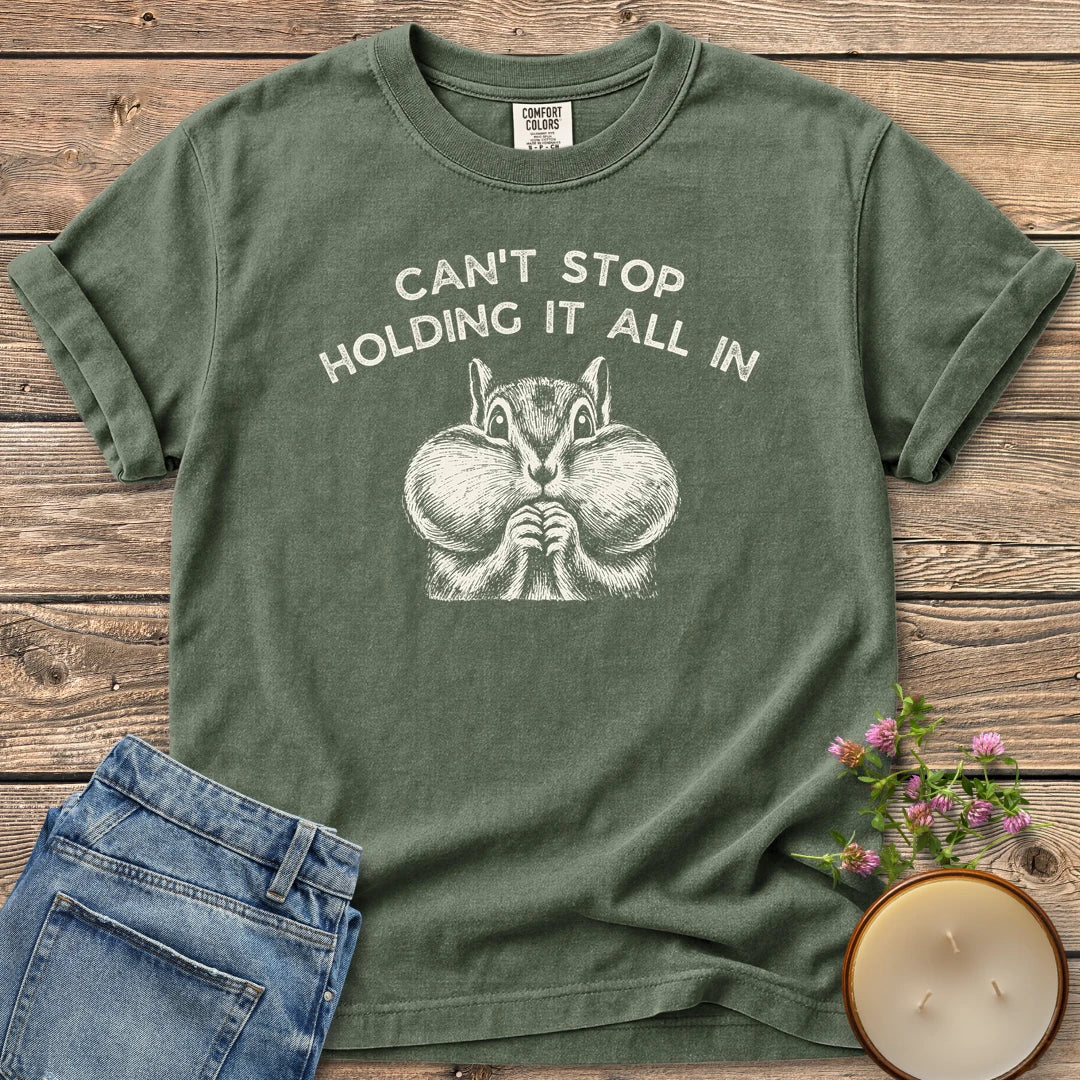 Holding It All In t-shirt, a chipmunk with puffed cheeks under Can't Stop Holding It All In, on a Moss Comfort Colors tee