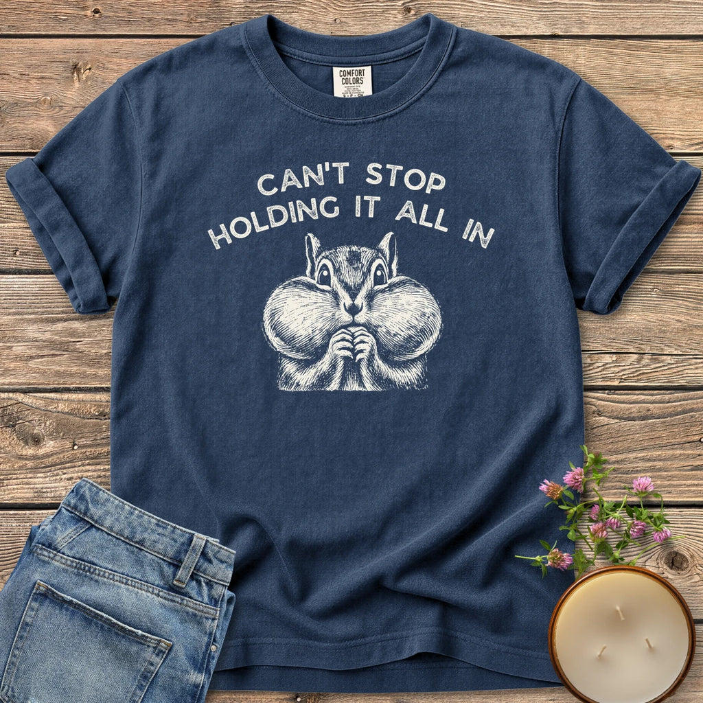Holding It All In t-shirt, a chipmunk with puffed cheeks under Can't Stop Holding It All In, on a Navy Comfort Colors tee