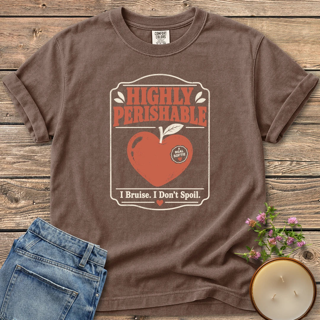 I Bruise I Don't Spoil t-shirt, a vintage label reading Highly Perishable with a heart-shaped apple and I Bruise. I Don't Spoil, on an Espresso Comfort Colors tee