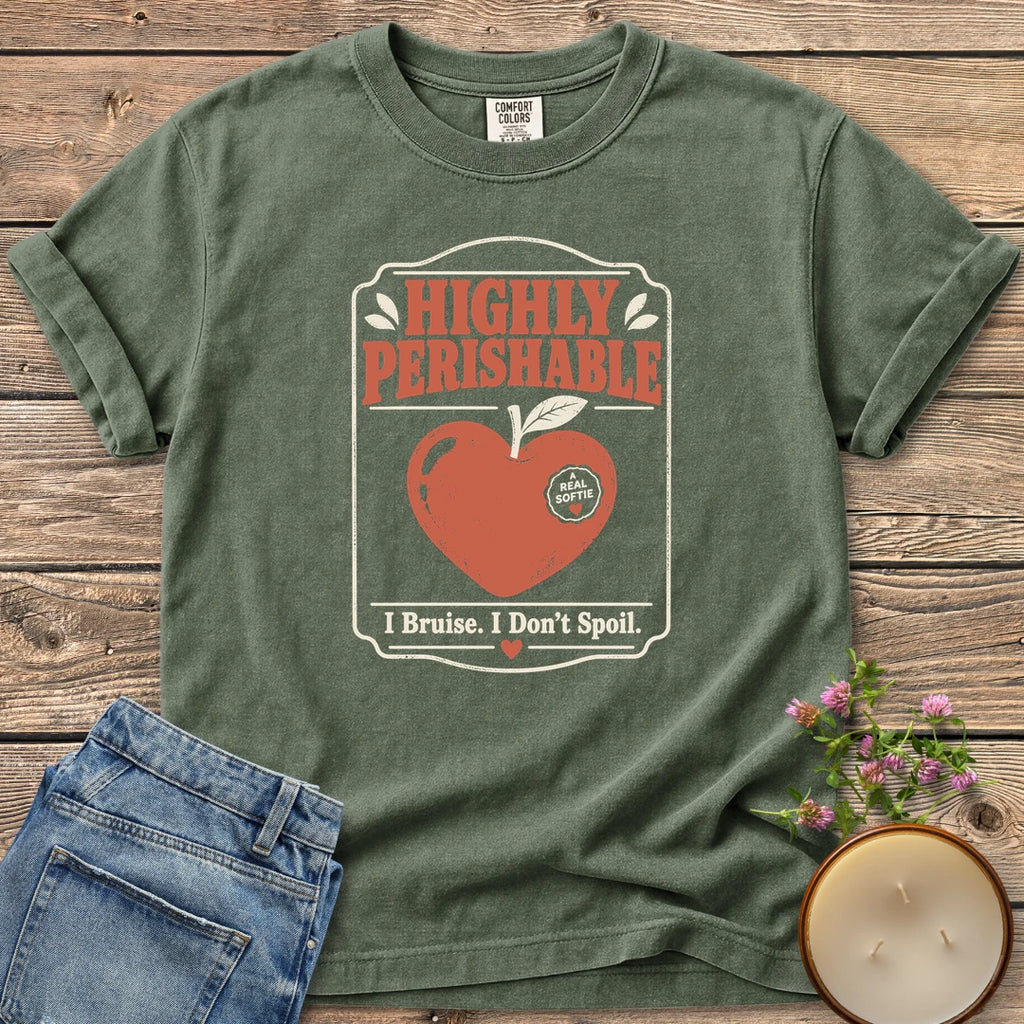 I Bruise I Don't Spoil t-shirt, a vintage label reading Highly Perishable with a heart-shaped apple and I Bruise. I Don't Spoil, on a Moss Comfort Colors tee