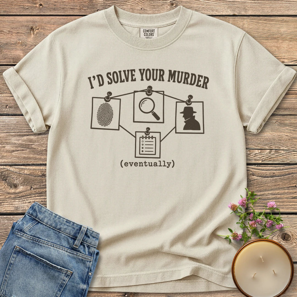 I'd Solve Your Murder Eventually t-shirt, I'd Solve Your Murder above a pinned evidence board and (eventually), on an Ivory Comfort Colors tee