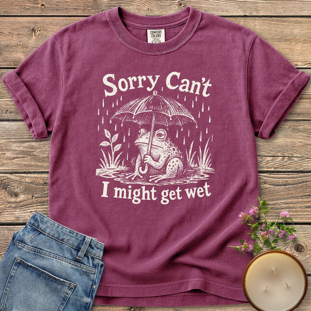 I Might Get Wet t-shirt, a frog under an umbrella in the rain between Sorry Can't and I might get wet, on a Berry Comfort Colors tee