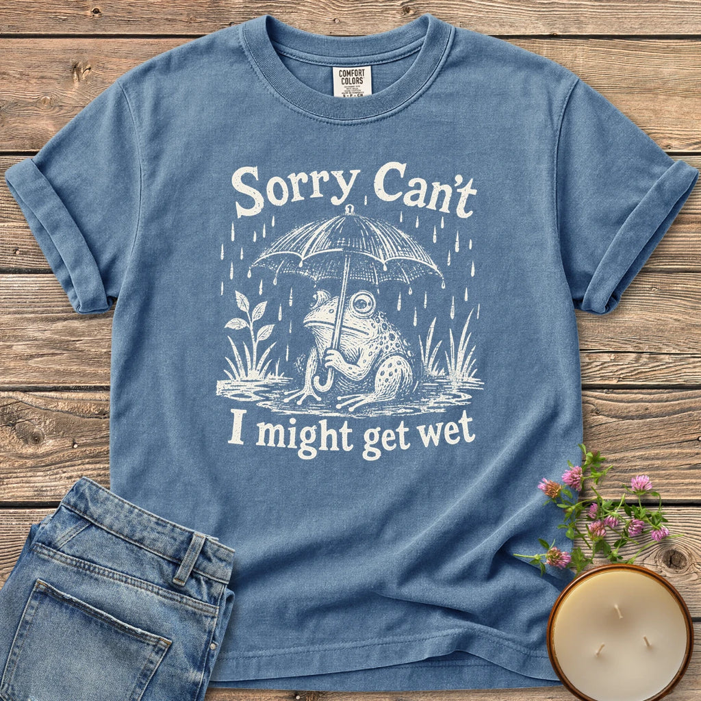 I Might Get Wet t-shirt, a frog under an umbrella in the rain between Sorry Can't and I might get wet, on a Blue Jean Comfort Colors tee