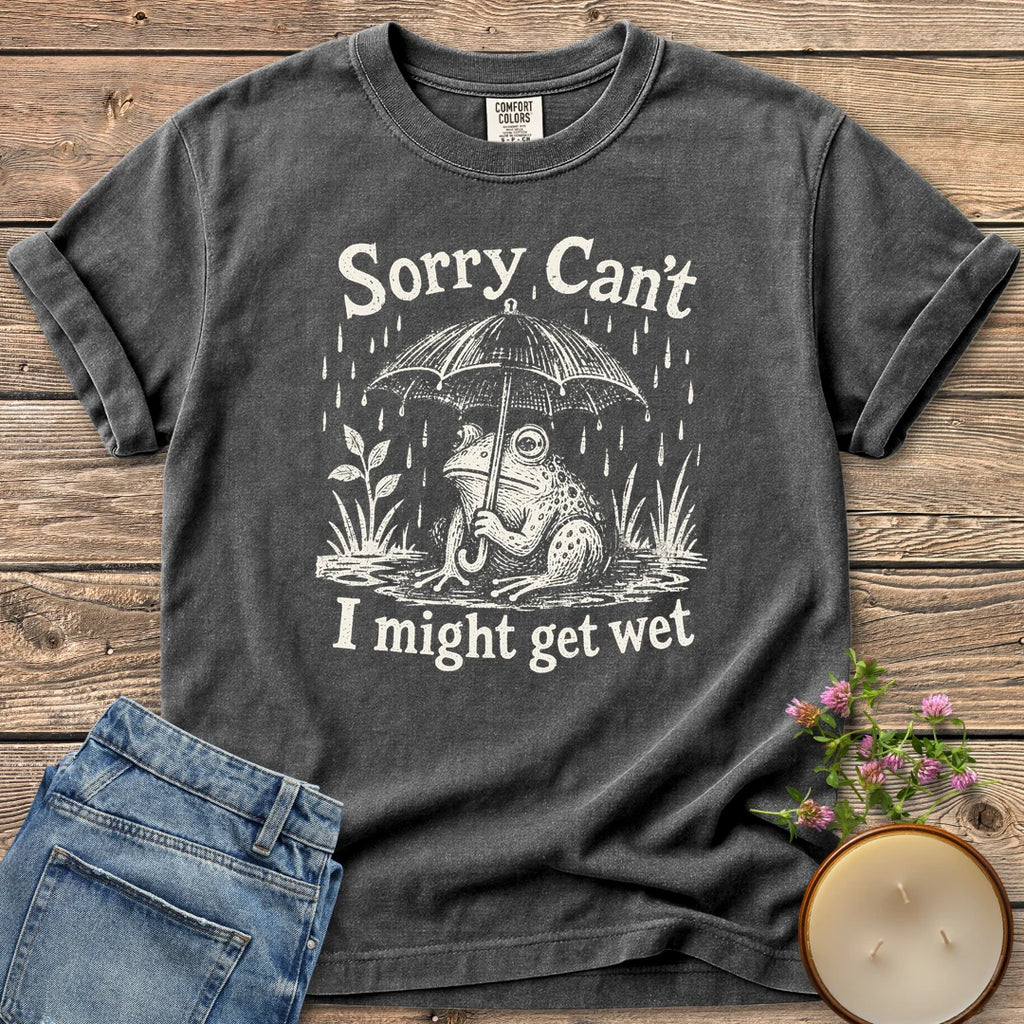 I Might Get Wet t-shirt, a frog under an umbrella in the rain between Sorry Can't and I might get wet, on a Pepper Comfort Colors tee